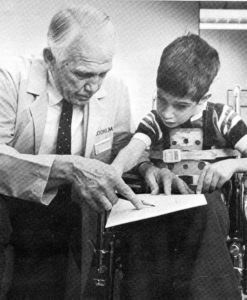 Dr. Robert Cooke with a patient in 1982.