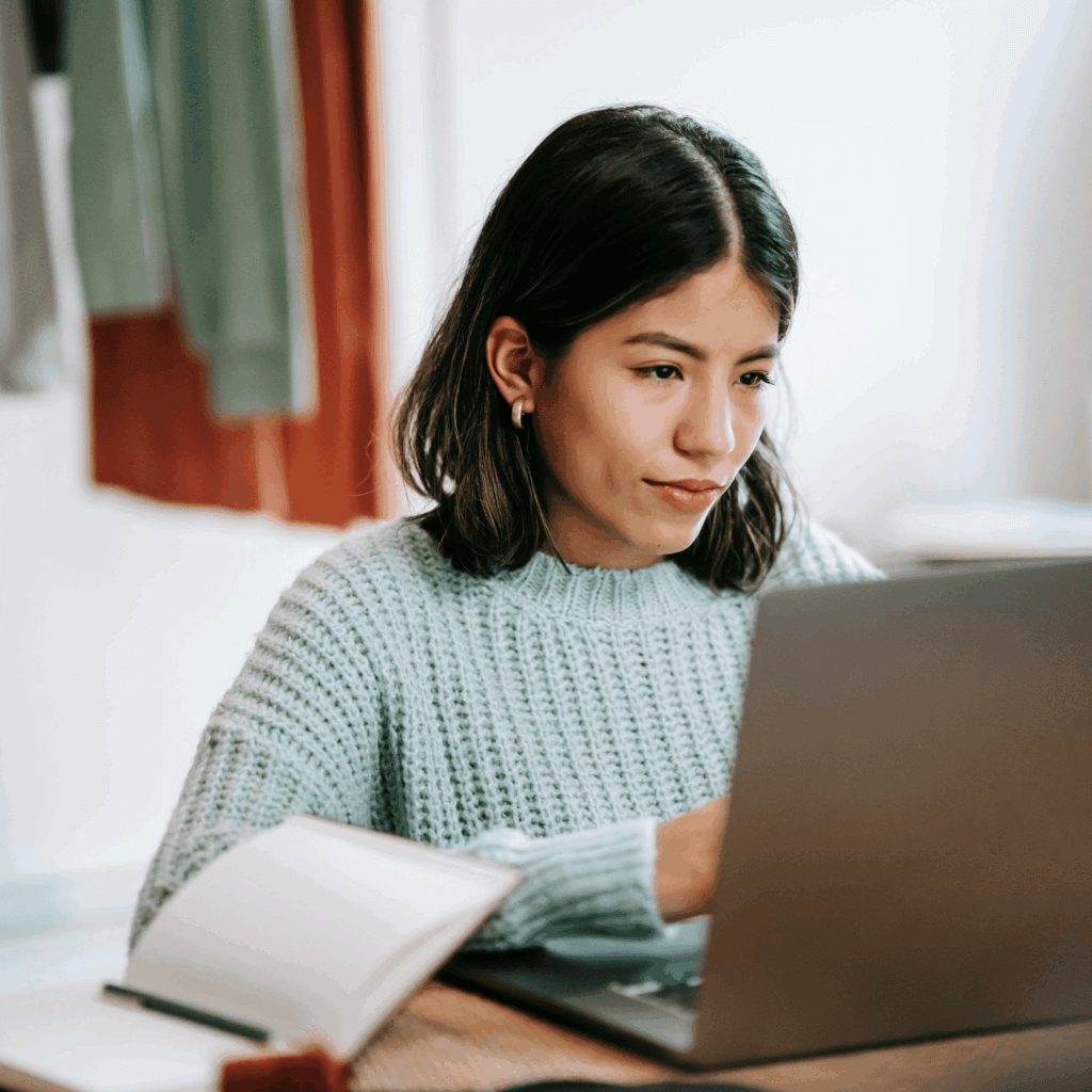 An educator looking at her laptop