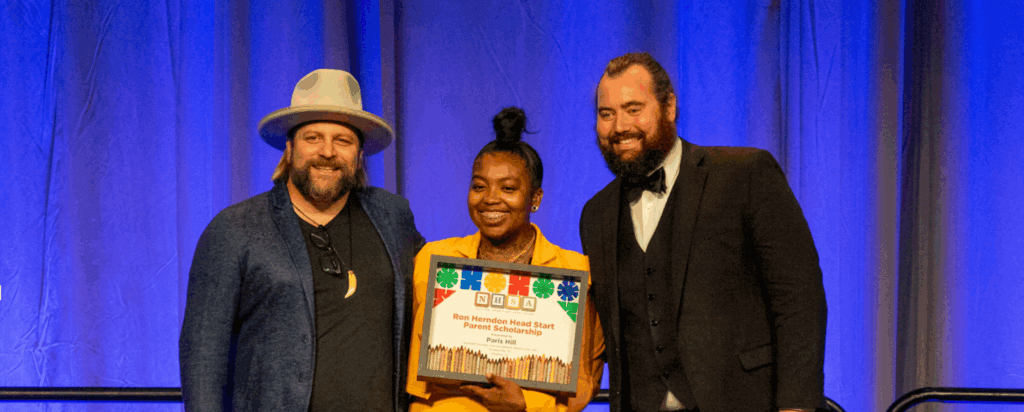 Photo of Paris Hill receiving NHSA's 2022 Herndon Scholarship Award